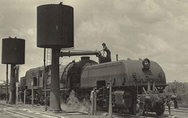 Class AD6002 Garratt locomotive taking water at Valley Heights. Digital ID 17420_a014_a014000240